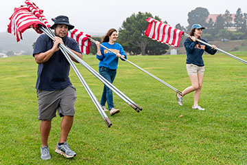 people carrying flags