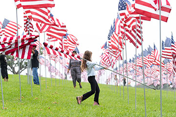 girl walking with flag 