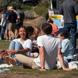 Students sitting in Alumni Park