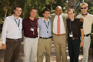 George Foreman poses for a picture with a group of students - Pepperdine University